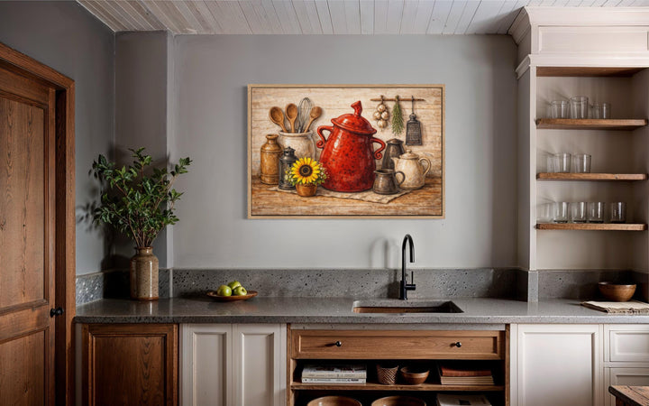 Rustic farmhouse kitchen wall art featuring a red ceramic pot and utensils on a canvas print.