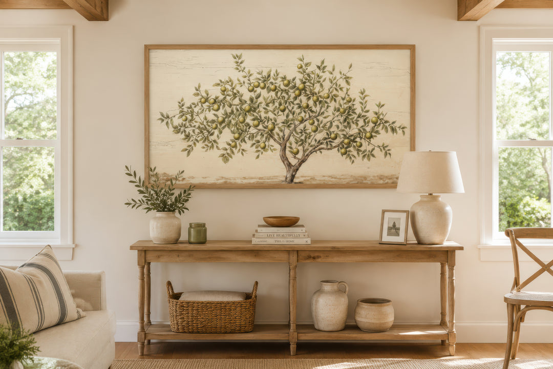 Rustic farmhouse wall art featuring a painted apple tree on canvas in a wooden frame.
