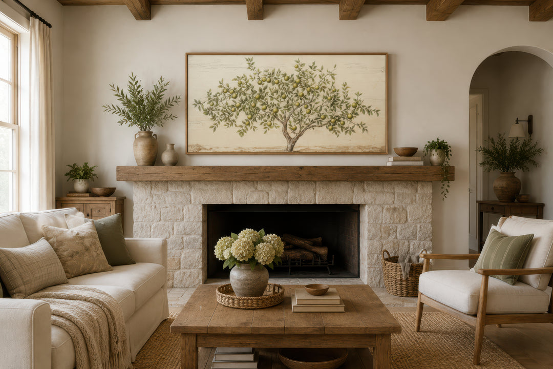 Framed rustic apple tree canvas wall art hanging above a fireplace in a farmhouse living room.