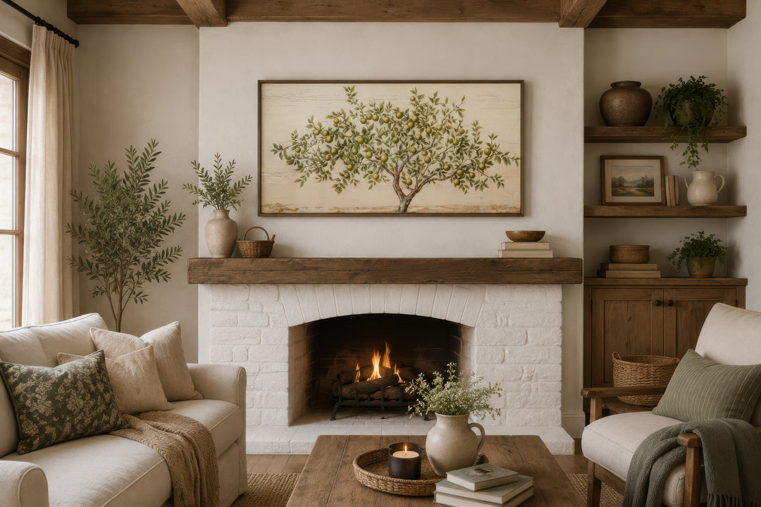 Framed rustic apple tree canvas wall art hanging above a white brick fireplace in a cozy living room.