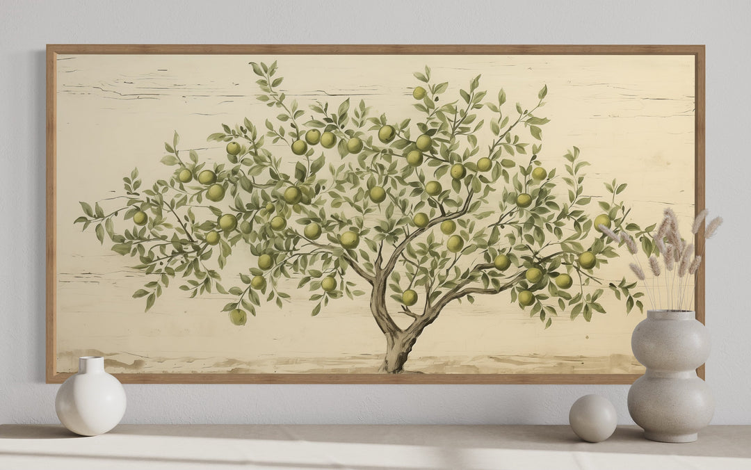 Rustic farmhouse wall art featuring a vintage-style apple tree painting in a wooden frame.