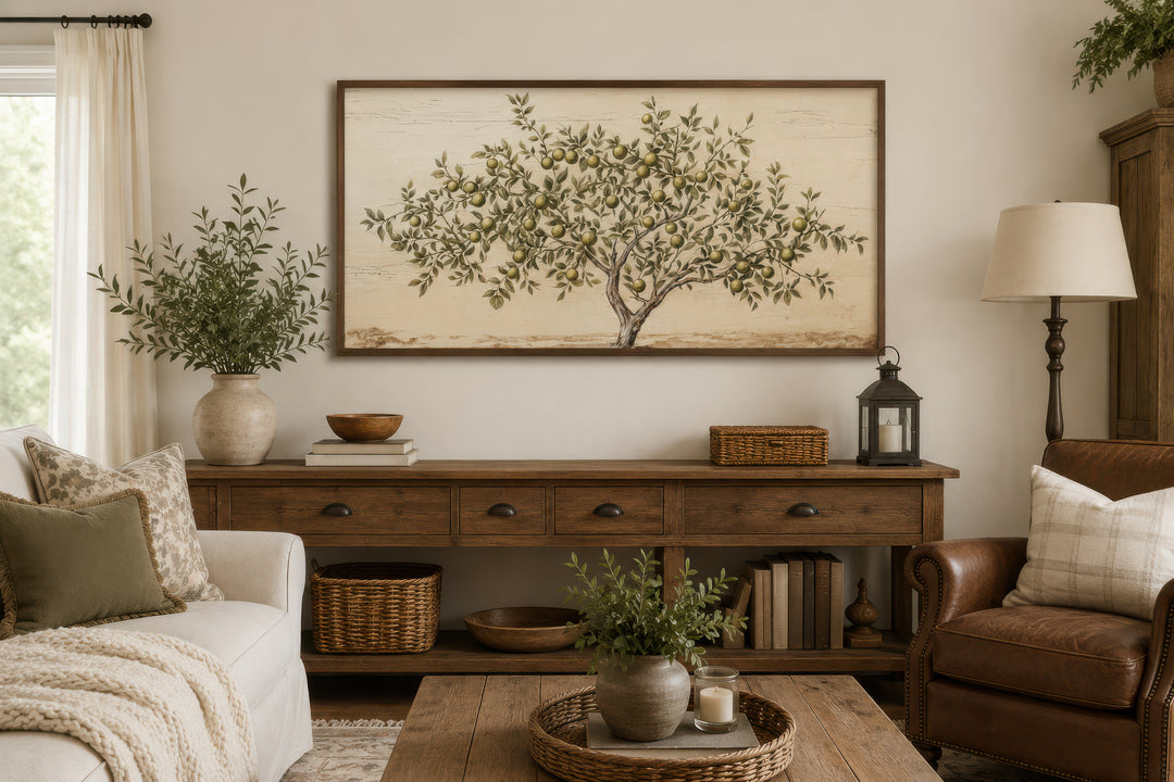 Rustic framed canvas wall art featuring a detailed apple tree painting in a farmhouse living room.