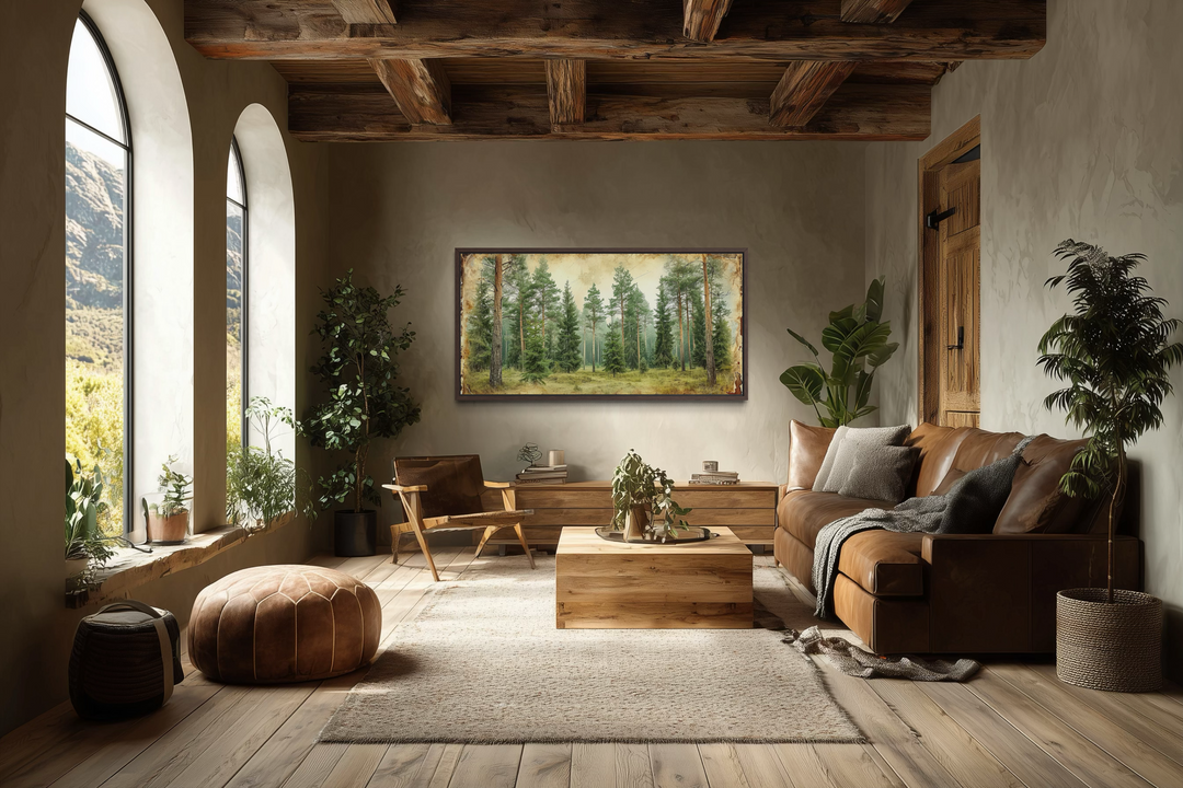 Framed canvas wall art featuring a rustic fir tree forest in a serene, earthy living room.