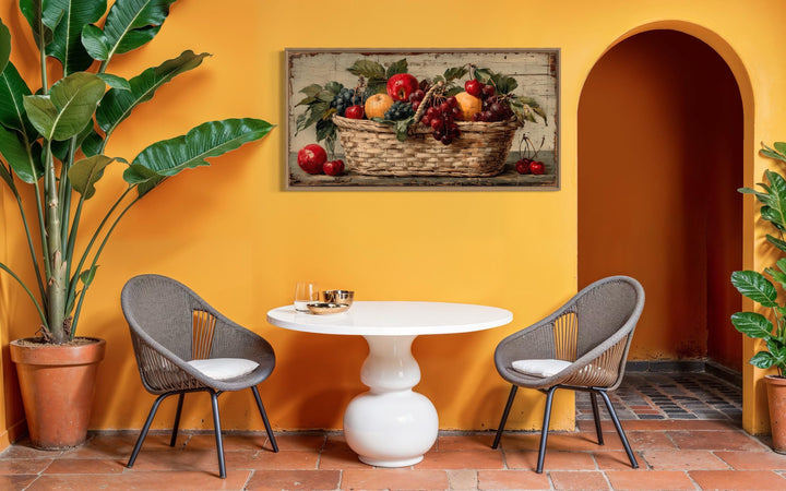 Rustic fruit basket painting on distressed wood canvas wall art in a warm yellow dining area.