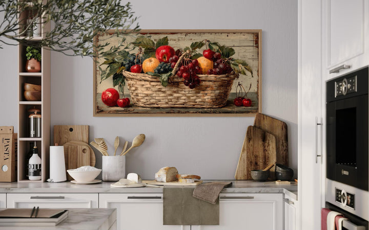 Rustic fruit basket painting on distressed wood canvas wall art in a farmhouse kitchen setting.
