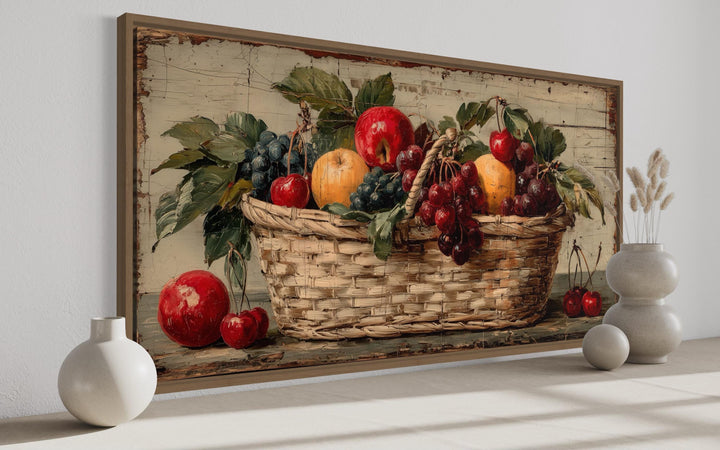Rustic fruit basket painting on distressed wood canvas wall art in a farmhouse kitchen setting.