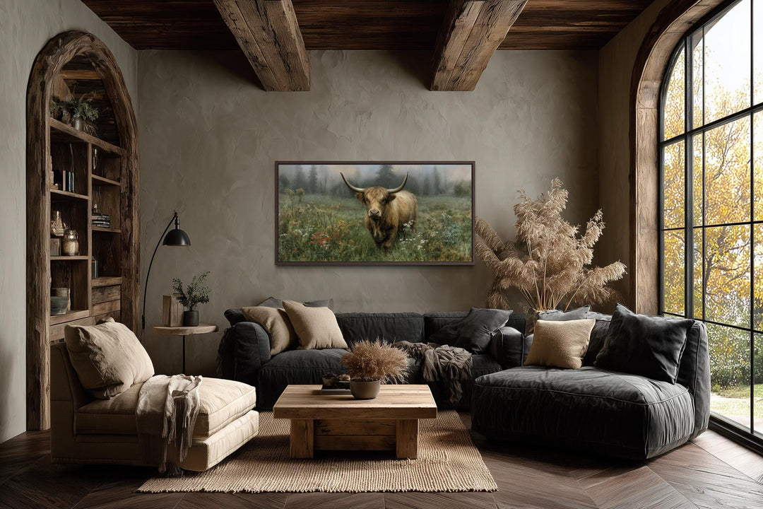 Rustic Highland cow vintage nature painting on a stretched canvas print in a cozy living room.