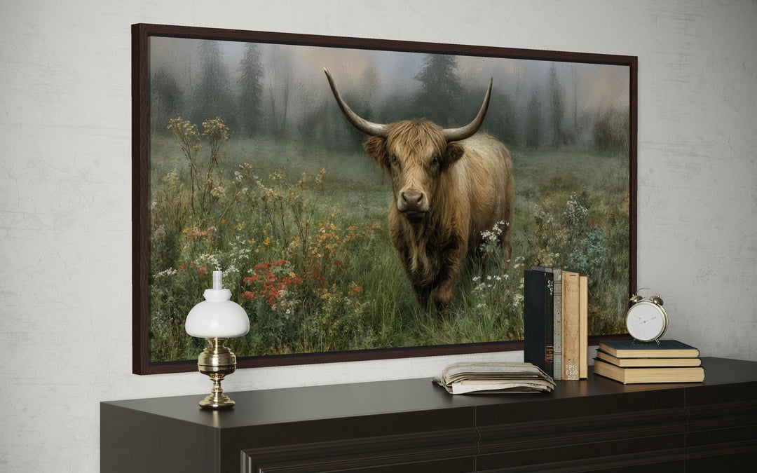 Rustic Highland cow vintage painting on a stretched canvas print displayed above a dark wood dresser.