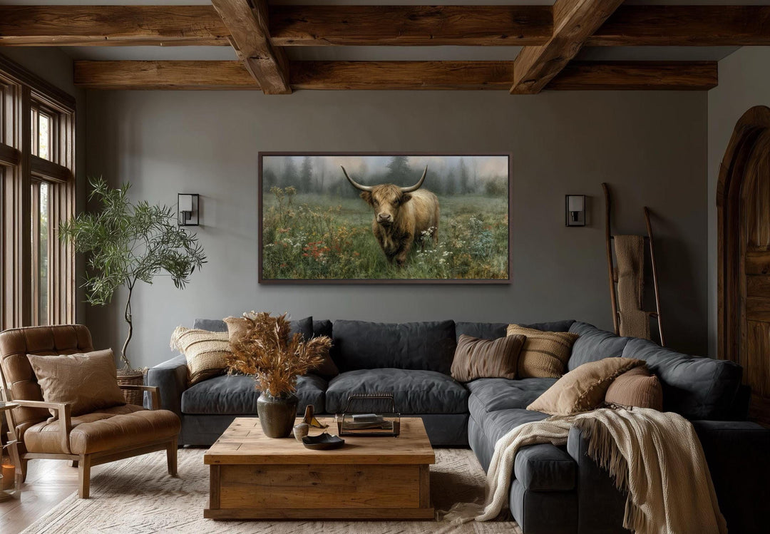 Rustic Highland cow vintage nature painting on a stretched canvas print in a cozy living room.