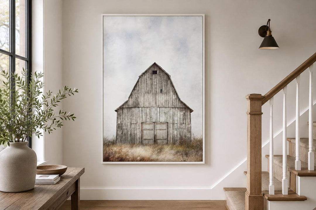Rustic old barn vertical canvas wall art in a white frame hanging in a farmhouse-style hallway.