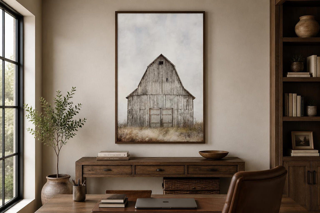 Rustic vertical canvas print of a weathered old barn in a field, hanging above a wooden console.