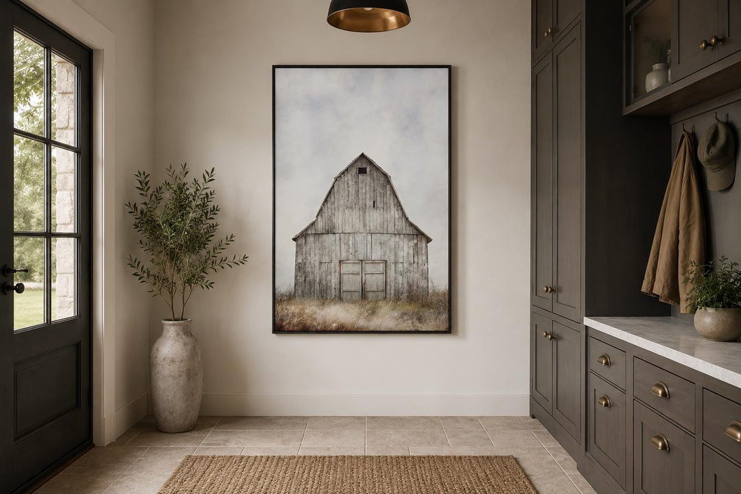 Rustic vertical canvas print of a weathered old barn in a field, hanging in a farmhouse entryway.