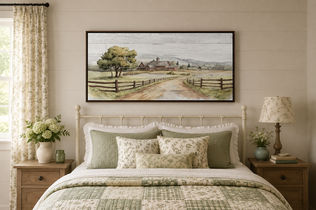 Rustic old barn landscape painting on wood-effect canvas, framed and hanging above a bed.