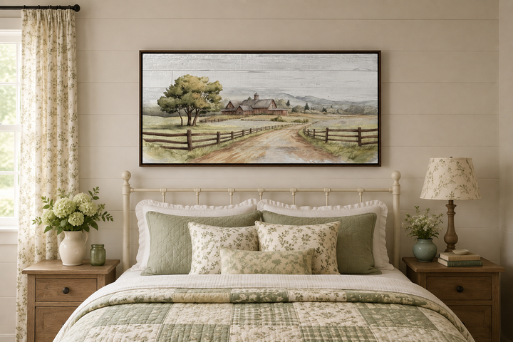 Rustic old barn landscape painting on wood-effect canvas, framed and hanging above a bed.
