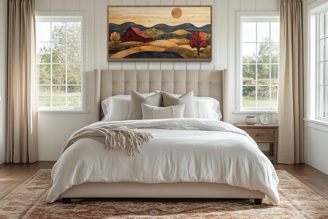 Rustic red barn and farm landscape wood style canvas wall art hanging above a bed in a bedroom.