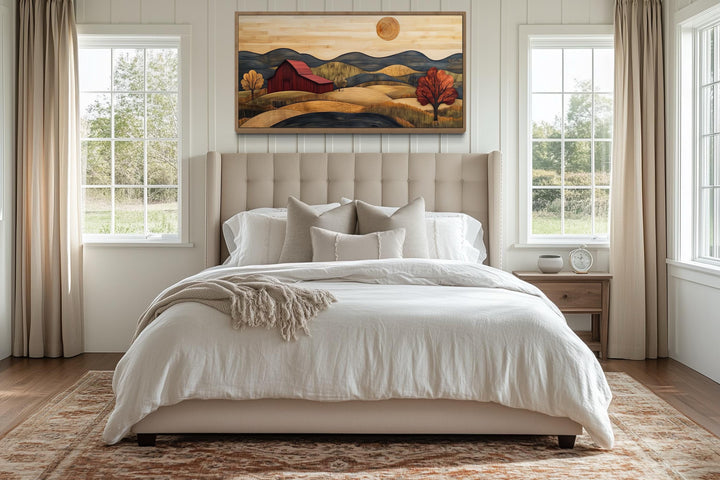 Rustic red barn and farm landscape wood style canvas wall art hanging above a bed in a bedroom.