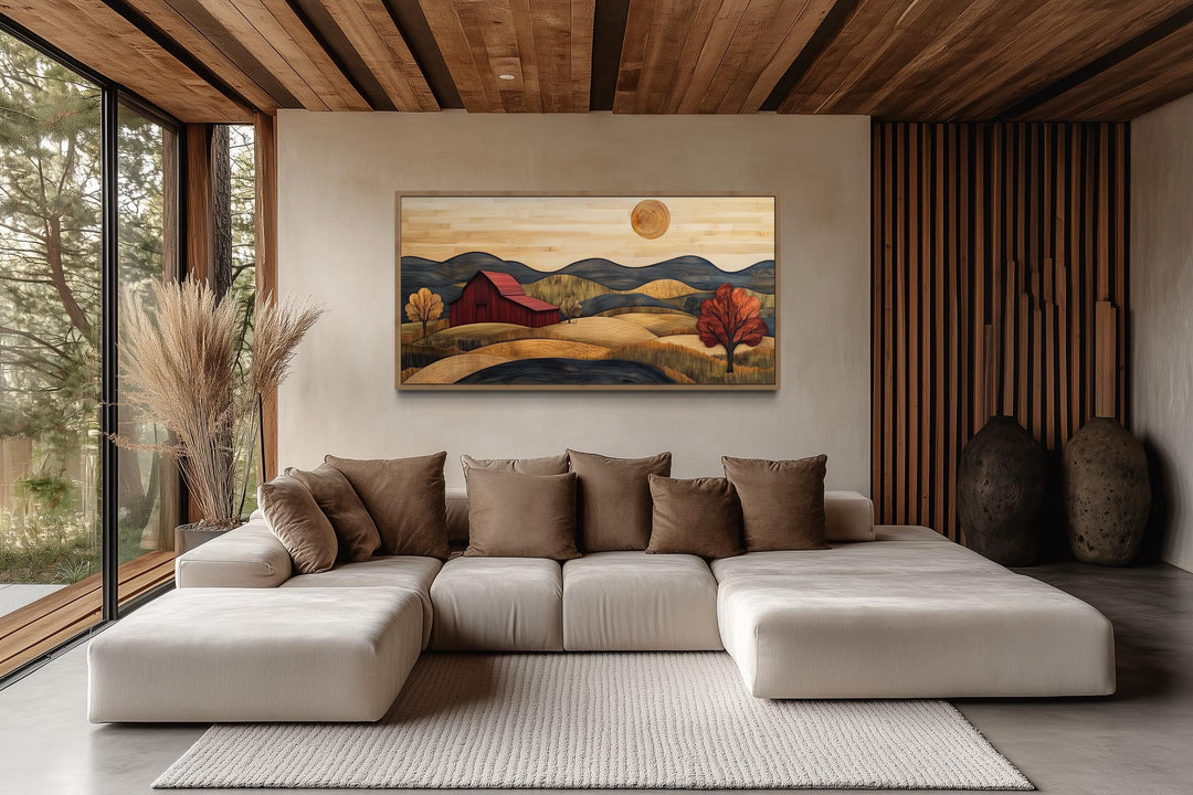 Rustic red barn and farm landscape wood style canvas wall art hanging above a modern sofa.
