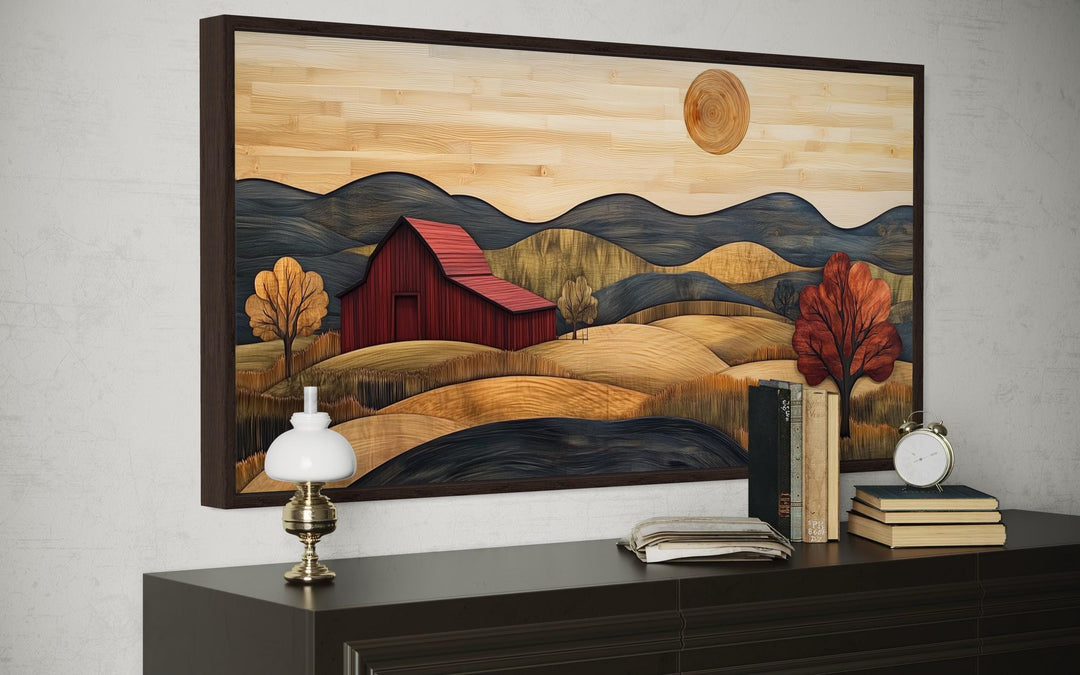 Rustic red barn and farm landscape wood style canvas wall art framed above a dark wood dresser.