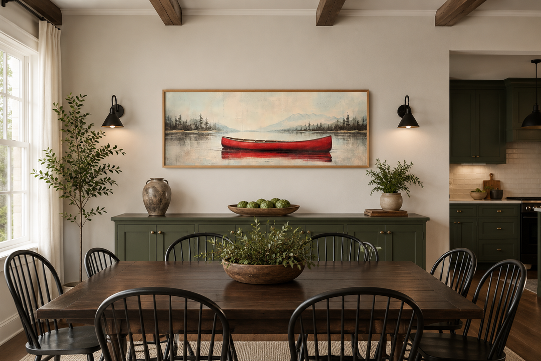Rustic red canoe on a calm lake painted on a long horizontal wood-framed canvas wall art.