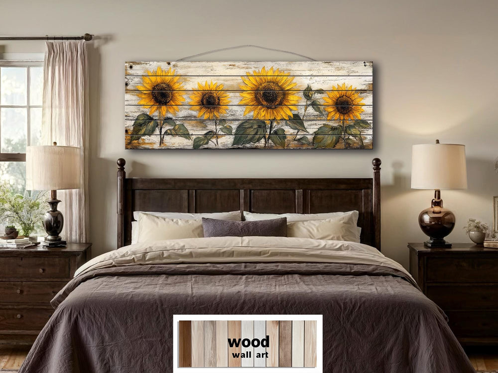 Rustic sunflower wall art on a long whitewashed wood panel displayed above a bed.