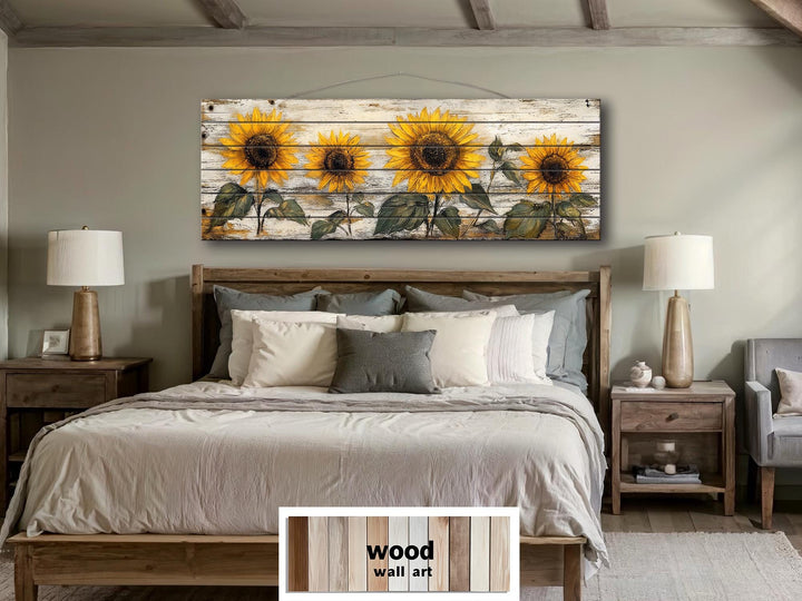 Rustic sunflower wall art on whitewashed wood panels hangs above a bed in a farmhouse bedroom.
