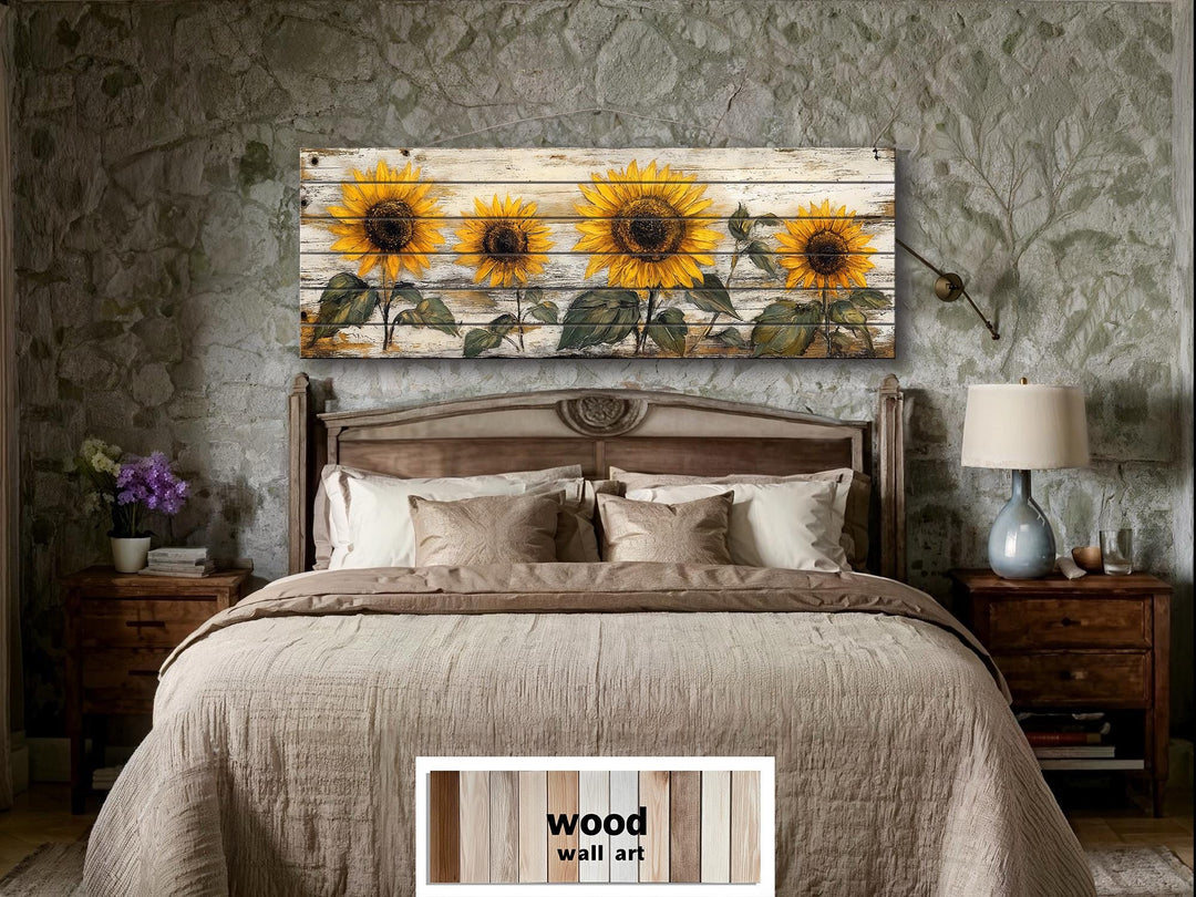 Rustic sunflower wall art on whitewashed wood panels hangs above a bed in a farmhouse bedroom.