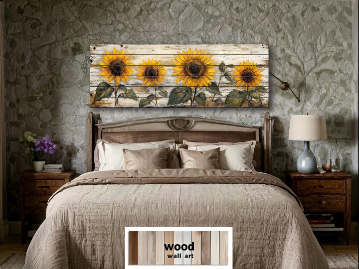Rustic sunflower wall art on whitewashed wood panels hangs above a bed in a farmhouse bedroom.