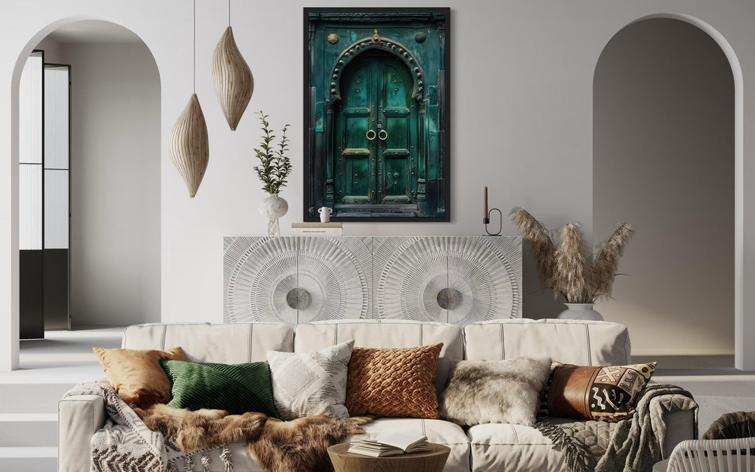 Rustic teal turquoise green vintage Indian door canvas wall art hanging above a white sideboard.