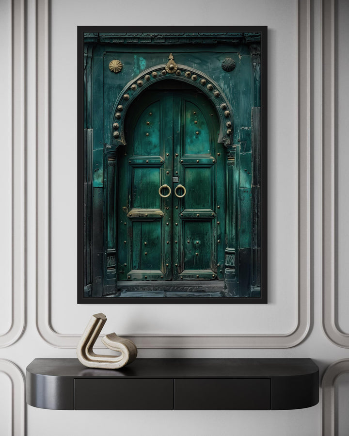 Rustic teal vintage Indian door canvas wall art in a black frame above a modern console table.