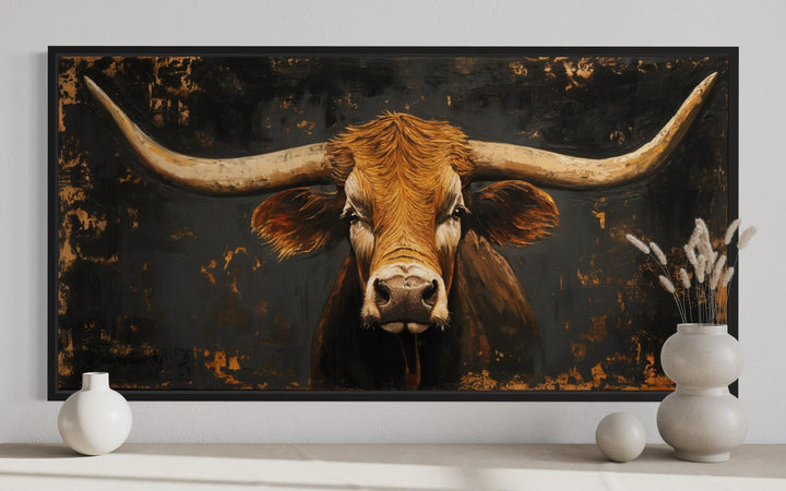 Extra large framed wall art of a rustic Texas longhorn cow with a dark, textured background.