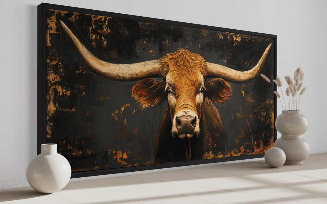 Extra large framed wall art of a rustic Texas longhorn cow with a dark, textured background.