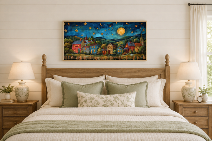 Rustic village wall art above a bed, featuring a starry night sky, moon, and colorful rural houses.