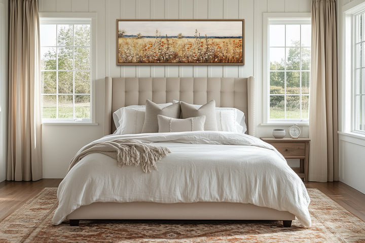 Horizontal canvas wall art featuring a rustic field of yellow wildflowers above a bed.