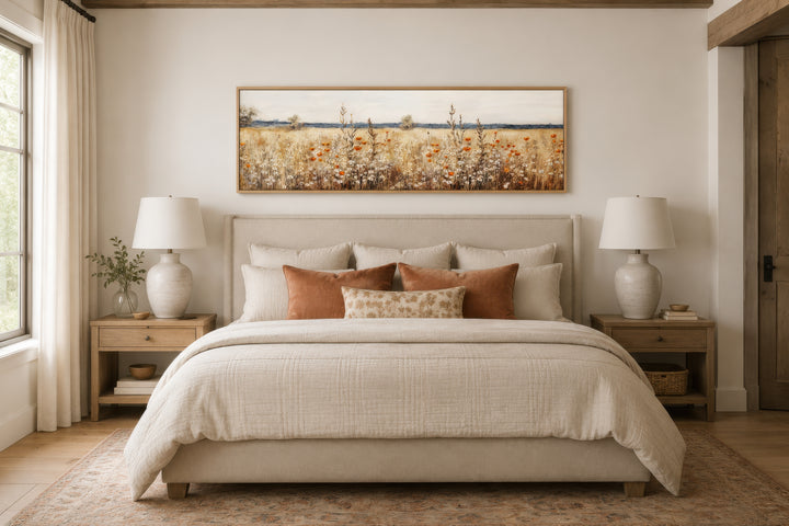 Horizontal canvas wall art featuring a rustic vintage field of yellow and orange wildflowers.