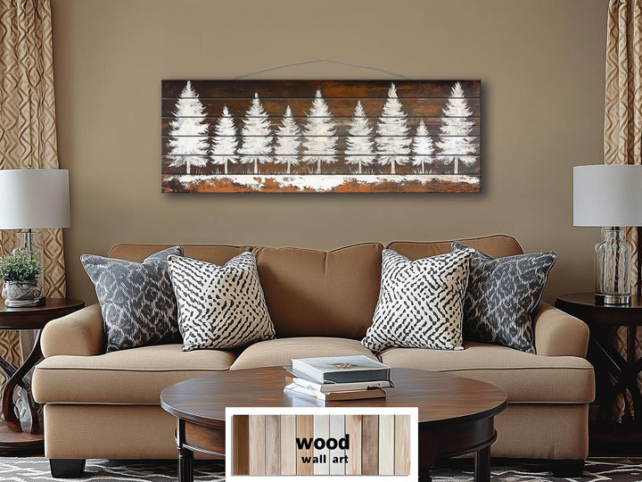 Rustic white pine tree silhouettes on a long, narrow distressed wood plank wall art piece.