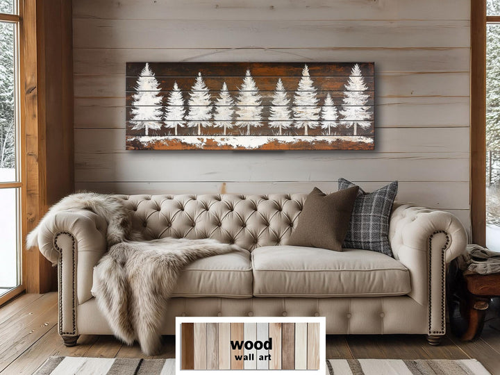 Rustic white pine tree silhouettes on a long, narrow distressed wood wall art panel.
