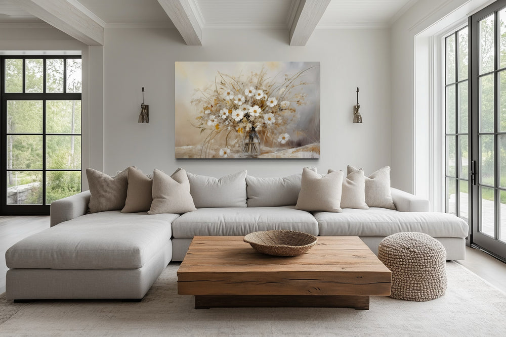 Rustic white wildflowers bouquet framed canvas wall art above a sofa in a farmhouse living room.