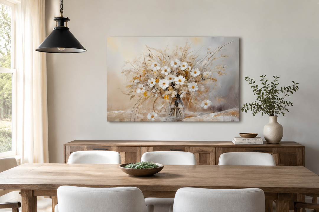Rustic white wildflowers bouquet painting on framed canvas in a neutral farmhouse dining room.
