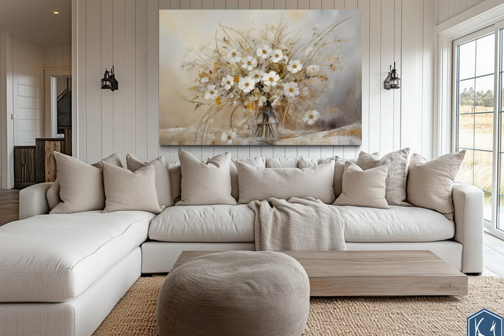 Rustic white wildflowers bouquet framed canvas wall art in a neutral farmhouse living room.