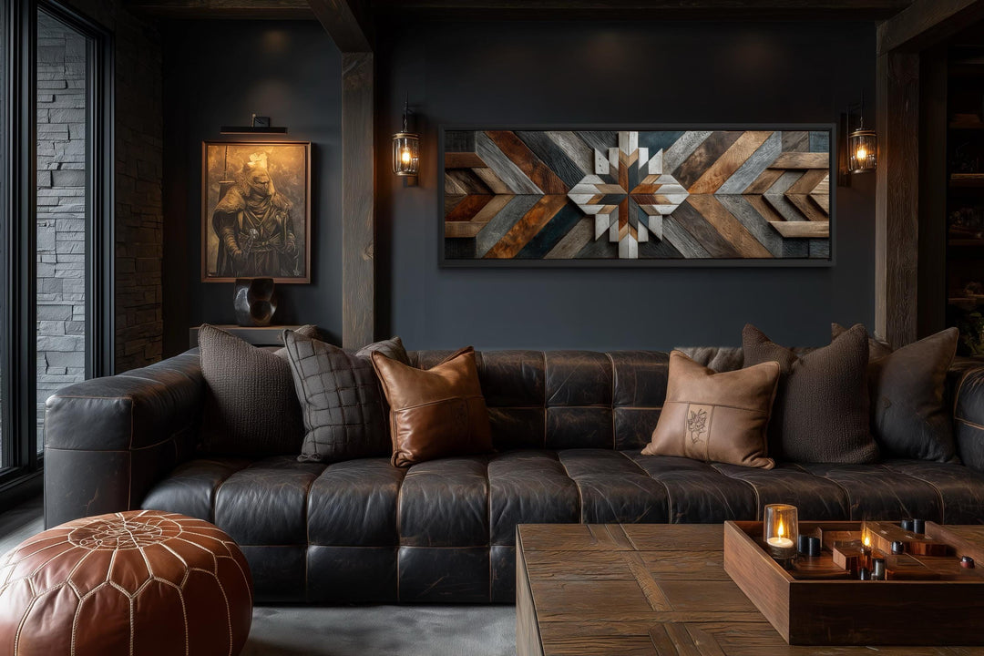 Rustic wood style geometric chevron painting on a long horizontal canvas in a dark, moody room.