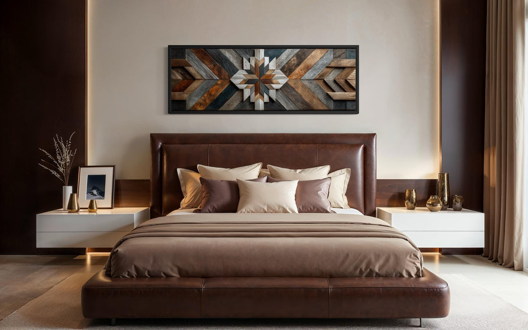 Rustic wood style geometric chevron canvas wall art in a long horizontal format above a bed.
