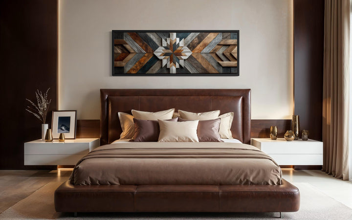 Rustic wood style geometric chevron canvas wall art in a long horizontal format above a bed.