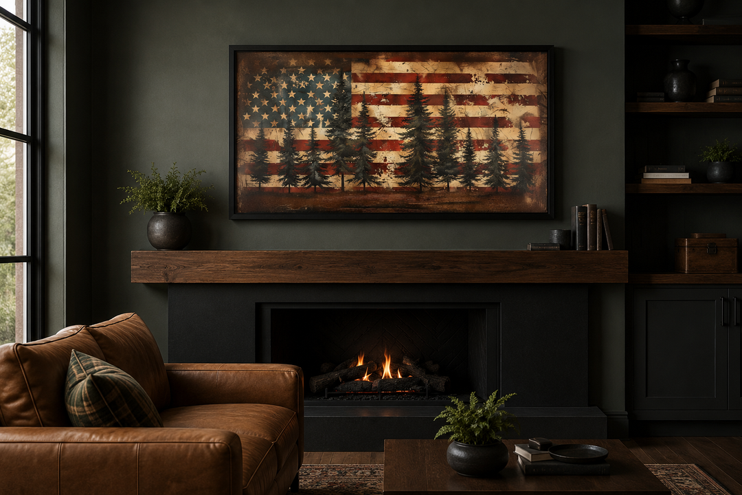 Framed rustic American flag canvas art with pine trees above a fireplace in a dark, moody room.