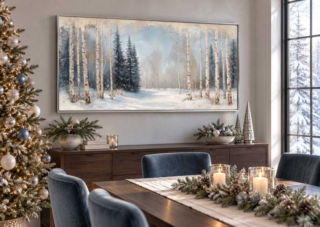 Rustic Birch Trees Forest in Winter canvas wall art in a silver frame above a dining room sideboard.