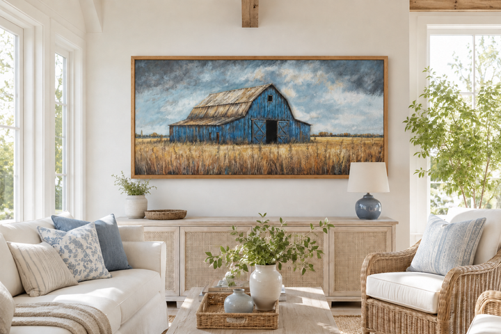 Rustic blue barn framed canvas wall art hanging above a sideboard in a farmhouse living room.