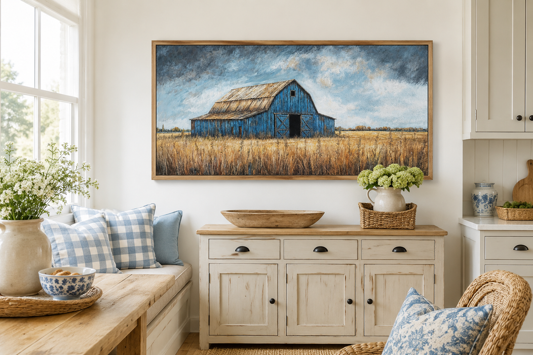Rustic blue barn framed canvas wall art above a cream sideboard in a farmhouse style room.