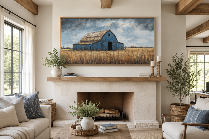 Rustic blue barn framed canvas wall art hanging above a fireplace in a farmhouse living room.