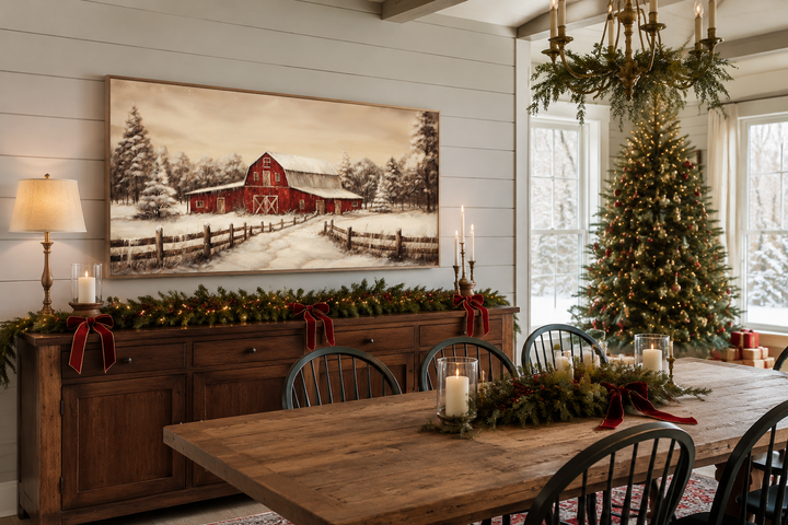 Framed canvas wall art of a red barn in a snowy winter landscape above a Christmas mantel.