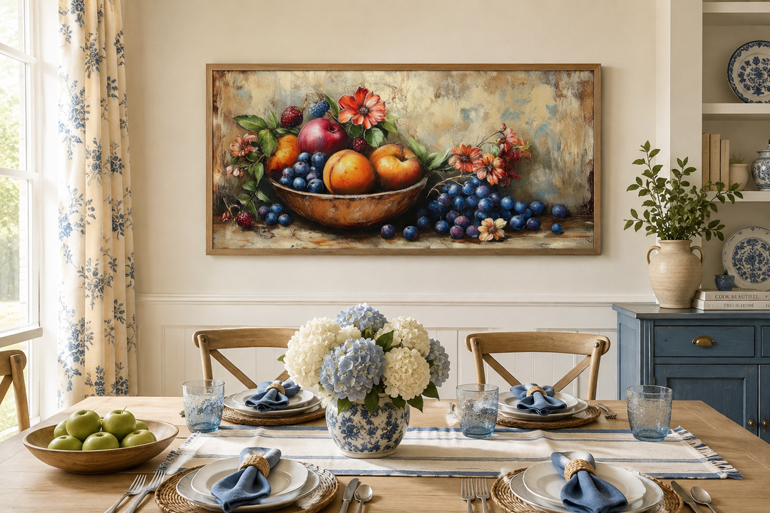 Vintage still life fruit bowl framed canvas wall art hanging above a set dining table.