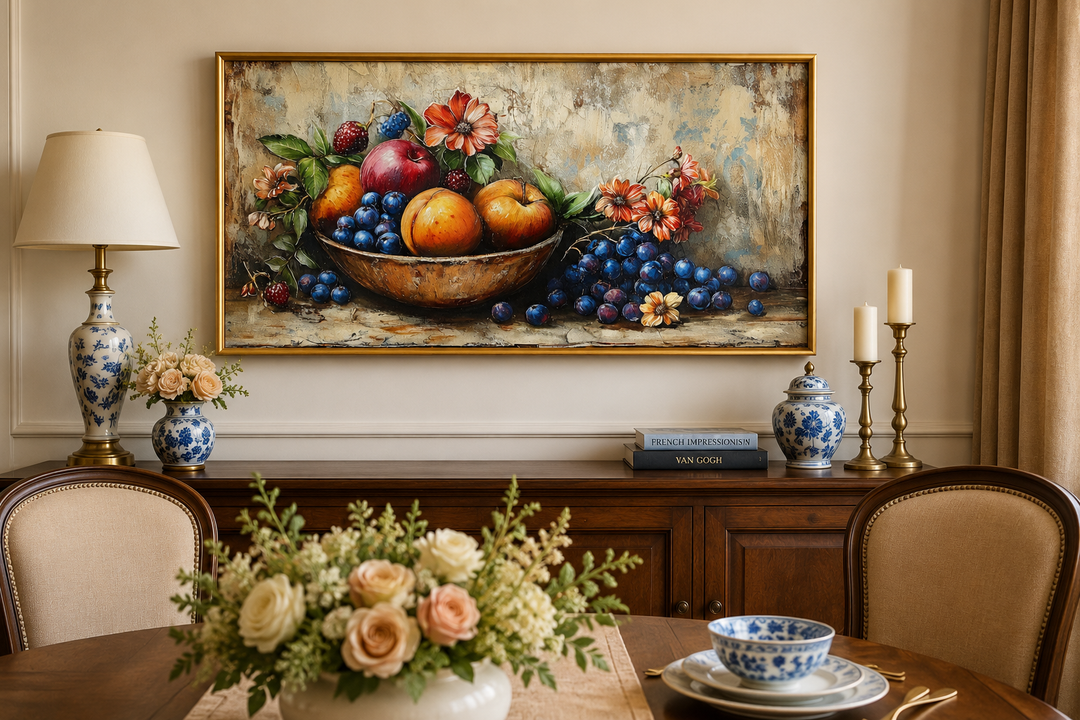 Vintage still life fruit bowl framed canvas wall art hanging above a wooden sideboard.